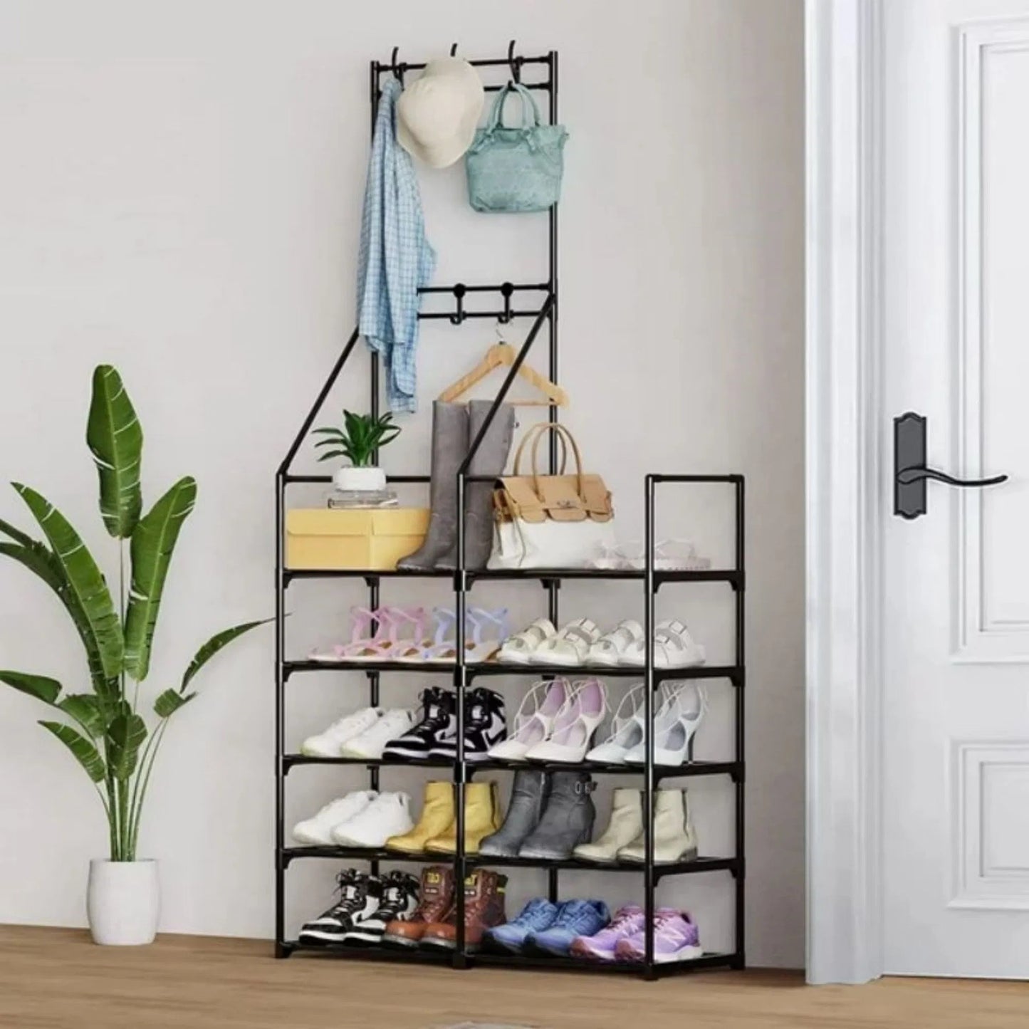 Shoe rack with various shoes and bags on shelves in a room with a plant and door.