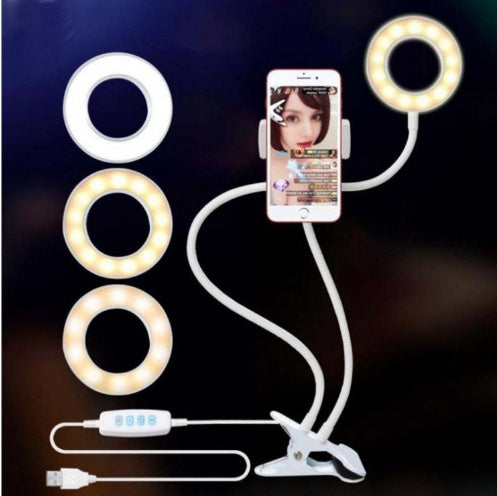 LED ring light with smartphone holder and USB cable on a dark background