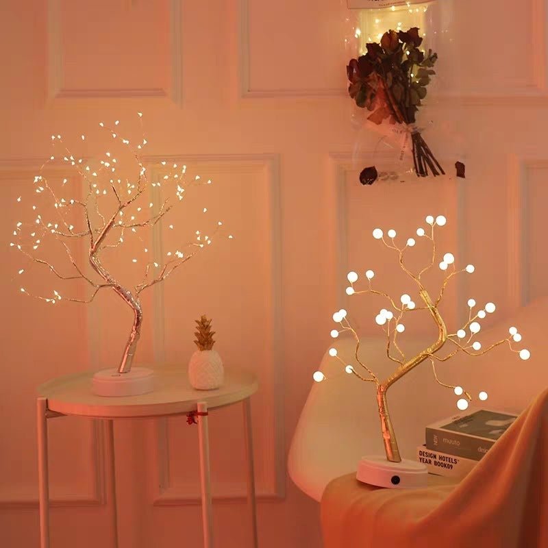 Decorative LED trees with lights in a room setting.