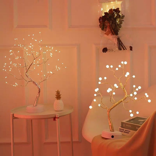 Decorative LED trees with lights in a room setting.