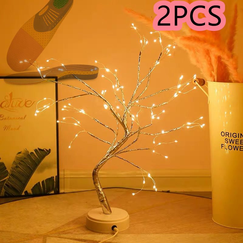 Decorative LED tree with lights on a wooden surface, with '2PCS' text overlay.