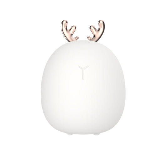 White spherical night light with gold antlers on a white background