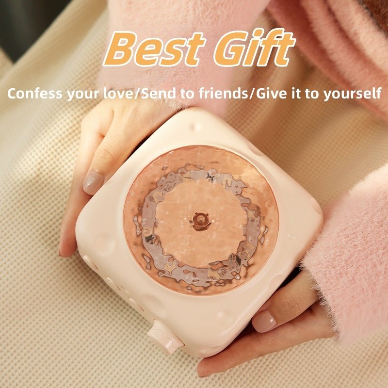 Person holding a small square item with circular design, labeled 'Best Gift' on a beige background.