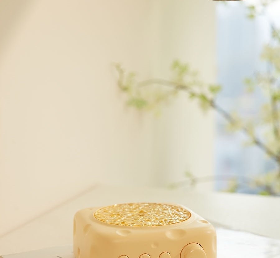 Square beige soap with textured top on a blurred natural background