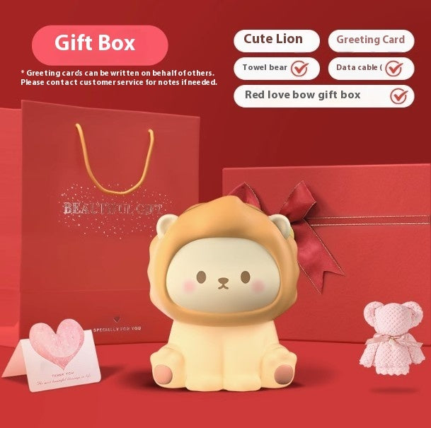 Cute lion toy with red gift box and accessories on a red background