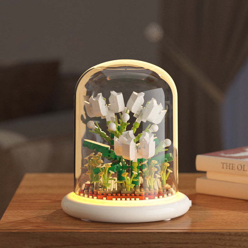 Decorative night light with floral design on a wooden surface