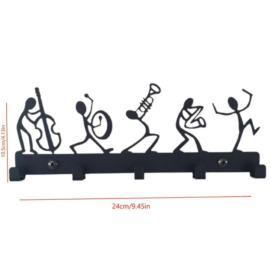 Decorative wall hook with stick figure design of musicians on a white background