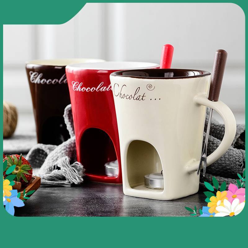 Three ceramic mugs with chocolate-themed design on a wooden surface.