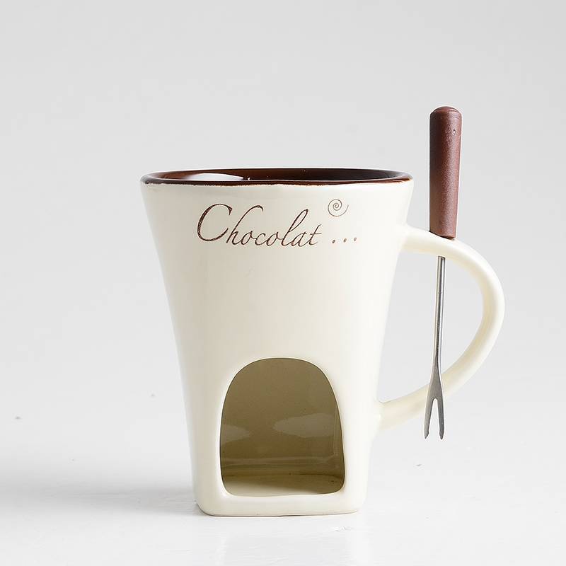 White mug with chocolate compartment and spoon on a white background