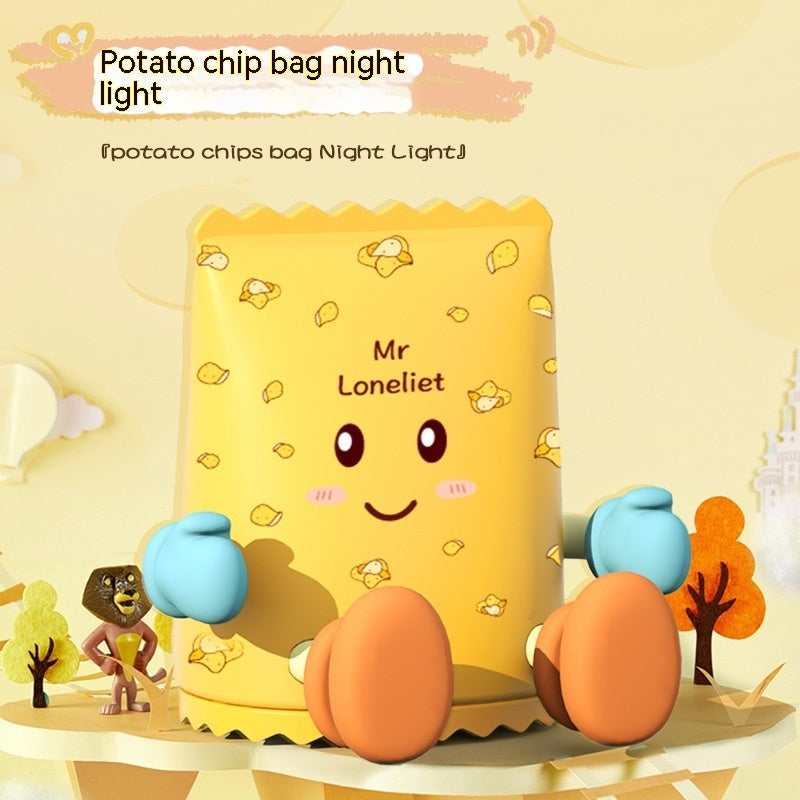 Yellow potato chip bag night light with cartoon face and small characters on a yellow background