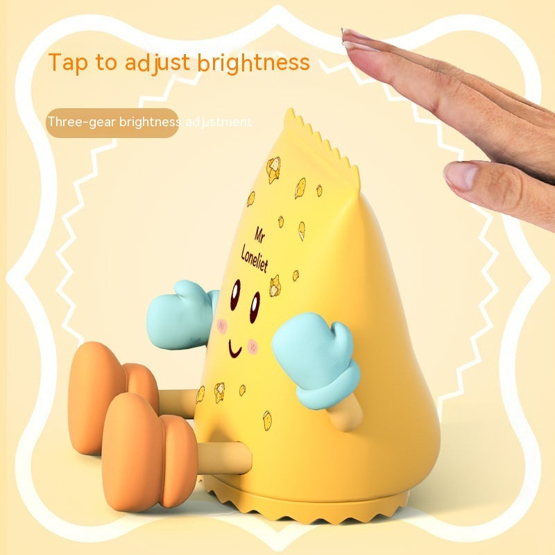 Yellow night light with cartoon character design on a beige background