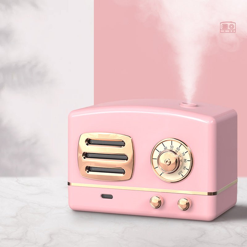 Pink vintage-style radio-shaped humidifier on a light gray background